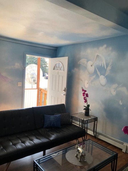 eggs flying out door wall painted with clouds and eggs with wings